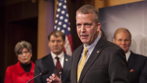 Senator Dan Sullivan speaks during a news conference with members of the Senate Armed Services Committee about arming Ukraine in the fight against Russia in Washington, D.C. on February 5, 2015. (Photo by Samuel Corum/Anadolu Agency/Getty Images)