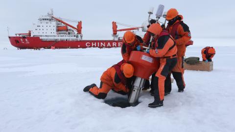 Members of China's research team set up an ocean profiling float at a short-term data acquisition location near the icebreaker Xuelong, or "Snow Dragon," in the Arctic Ocean, on August 18, 2016. (Xinhua/Wu Yue via Getty Images) 