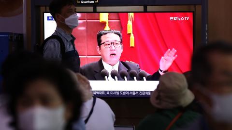 People watch a television broadcast showing a file image of a North Korean leader Kim Jong-Un at the Seoul Railway Station on June 5, 2022, in Seoul, South Korea. (Chung Sung-Jun/Getty Images)