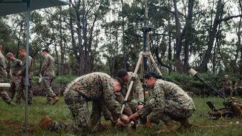 U.S. service members with 3d Battalion, 3d Marines; 3d Radio Battalion, III Marine Expeditionary Force Information Group; and 2nd Infantry Brigade Combat Team, 25th Infantry Division, gauge equipment on a Versatile Radio Observation and Direction on Schofield Barracks, Hawaii, Nov. 16, 2021. Marines with 3d Battalion, 3d Marines participated in a joint electronic warfare training event with 3d Radio Battalion, III MIG, and U.S. Army 25th Infantry Division where Marines and Soldiers learned and effectively u