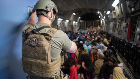 A U.S. Air Force security forces raven, assigned to the 816th Expeditionary Airlift Squadron, maintains security aboard a U.S. Air Force C-17 Globemaster III aircraft in support of the Afghanistan evacuation at Hamid Karzai International Airport (HKIA), Afghanistan, Aug. 24, 2021. (U.S. Air Force photo by Master Sgt. Donald R. Allen)