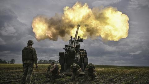 Ukrainian servicemen fire a Caesar self-propelled howitzer toward Russian positions at a front line in Donbas, Ukraine, on June 15, 2022. (Aris Messinis/AFP via Getty Images)