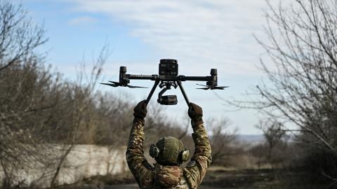 A Ukrainian serviceman flies a drone to spot Russian positions near the city of Bakhmut, in the region of Donbas, on March 5, 2023. (Photo by Aris Messinis / AFP) (Photo by ARIS MESSINIS/AFP via Getty Images)
