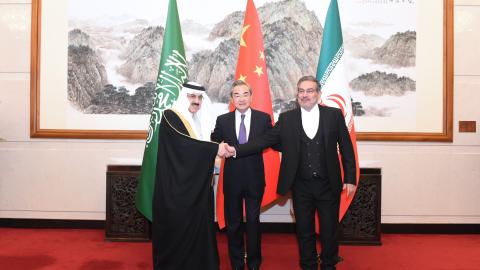 Saudi Minister of State Musaad bin Mohammed Al-Aiban, CCP Politburo member Wang Yi, and Iranian Secretary of the Supreme National Security Council Ali Shamkhani in Beijing, on March 10, 2023. (Luo Xiaoguang/Xinhua via Getty Images)