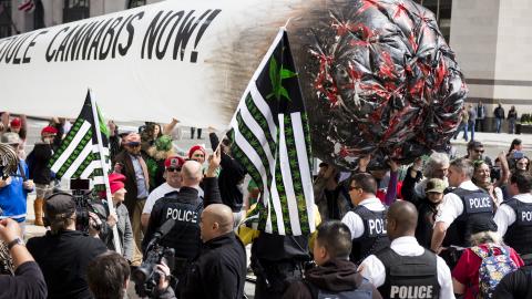  STATES - APRIL 2: Secret Service block pro-marijuana protesters from carrying their 51-foot inflated marijuana joint down Pennsylvania Avenue in front of the White House on Saturday, April 2, 2016. The DCMJ, DC Cannabis Campaign, organized the protest at the White House to call on President Barack Obama to reschedule cannabis. (Photo By Bill Clark/CQ Roll Call)