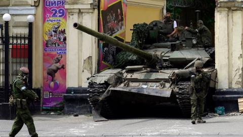  Members of Wagner patrol in an area near a tank outside a circus building in the city of Rostov-on-Don, Russia, on June 24, 2023. (Photo by STRINGER/AFP via Getty Images)