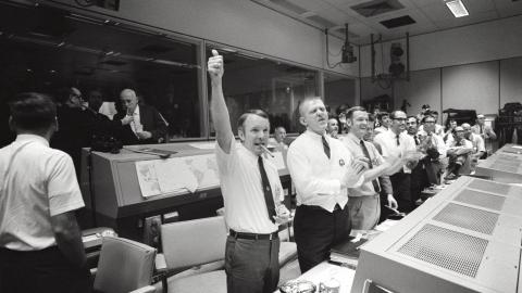 Three of the four Apollo 13 flight directors applaud the successful splashdown of the Command Module Odyssey on April 17, 1970. (NASA via Getty Images)