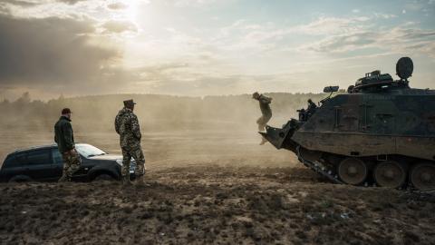Ukrainian soldiers use an armored engineer vehicle based on a Leopard tank chassis to pull their comrades car from a ditch on May 11, 2023. (Serhii Mykhalchuk/Global Images Ukraine via Getty Images)
