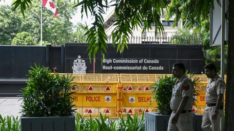Security personnel stand guard in front of the High Commission of Canada in New Delhi on September 19, 2023. (Arun Sankar/AFP via Getty Images)