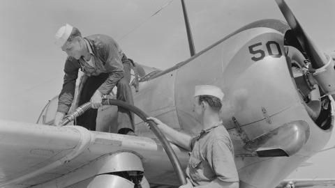 Sailor mechanics filling plane with gasoline at Naval Air Station Corpus Christi, Texas, in  August 1942. (Universal History Archive via Getty Images)