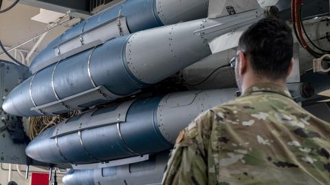 A 7th Aircraft Maintenance Squadron weapons load crew member assists in the transportation of the Launcher Load Frame to the flight-line for loading at Dyess Air Force Base, Texas, Jan. 9, 2023. The concept for pre-loading munitions has been around since the B-1 first entered service but has gone unused for 30 years until 7 AMXS resurrected the capability this winter. The LLF is a piece of equipment that allows weapons loaders to pre-load munitions on a launcher, under the cover of a facility, prior to tran