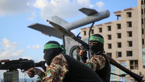 Members of the Ezzedine al-Qassam Brigades attend a memorial to a model of Shehab drone during a rally in Gaza City on September 21, 2022. (Majdi Fathi/NurPhoto via Getty Images)