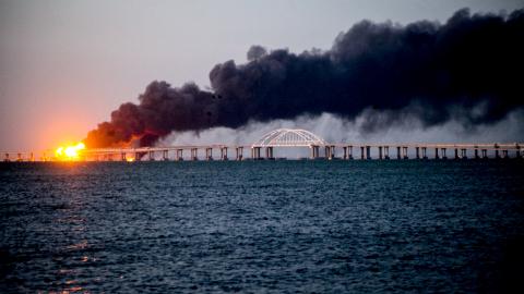 A fire on the Kerch Bridge following a truck bomb attack on October 8, 2022. (Photo by Vera Katkova/Anadolu Agency via Getty Images)