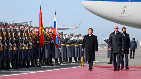 Chinese President Xi Jinping inspects the honor guard of the three services and watches the march-past at the Moscow Vnukovo Airport in Moscow, Russia, on March 20, 2023. (Xie Huanchi/Xinhua via Getty Images)