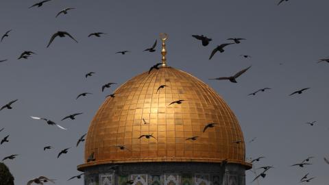 Birds fly in front of the Dome of the Rock shrine at the Al-Aqsa mosque compound in Jerusalem on March 24, 2023. (Ahmad Gharabli/AFP via Getty Images)