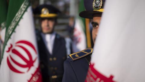 Members of an Iranian Army honor guard stand next to Iran's flags during a military parade marking Iran's Army Day anniversary near the Imam Khomeini shrine in the south of Tehran on April 18, 2023. (Morteza Nikoubazl/NurPhoto via Getty Images)