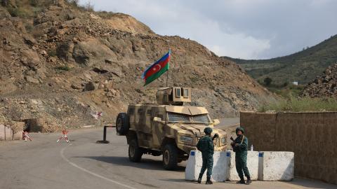Azerbaijani servicemen stand guard at the Lachin checkpoint on October 1, 2023. (Photo by Emmanuel Dunand/AFP via Getty Images)