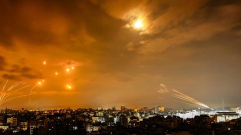 Rockets fired by Palestinian militants from Gaza City are intercepted by the Israeli Iron Dome missile defense system on October 8, 2023. (Eyad Baba/AFP via Getty Images)