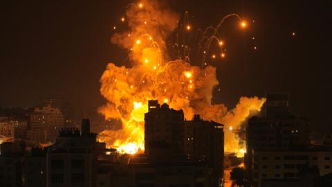 A missile explodes in Gaza City during an Israeli air strike on October 8, 2023. (Photo by MAHMUD HAMS/AFP via Getty Images)