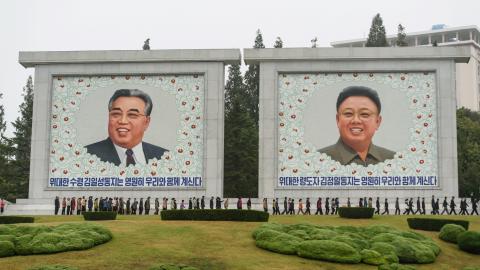 People line up to visit huge portraits of late North Korean leaders Kim Il Sung and Kim Jong Il, on the occasion of the 78th founding anniversary of the Workers' Party of Korea (WPK) in Pyongyang on October 10, 2023. (Photo by KIM Won Jin / AFP) (Photo by KIM WON JIN/AFP via Getty Images)