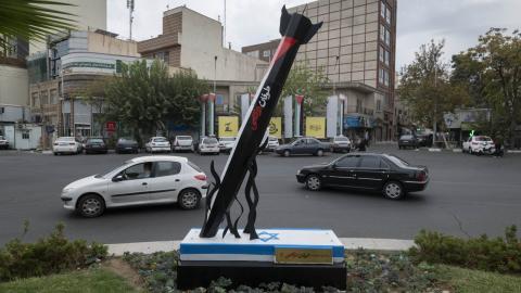 Vehicles drive past an anti-Israel urban artwork constructed and implemented by the municipality of Tehran, symbolizing Iran's support for the Palestinian Al-Aqsa storm missile attack on Israel, in downtown Tehran, October 12, 2023. (Photo by Morteza Nikoubazl/NurPhoto via Getty Images)
