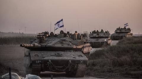 Israeli tanks move near Gaza border as Israeli army deploys military vehicles around the Gaza Strip, Israel, on October 12, 2023. (Mostafa Alkharouf/Anadolu via Getty Images)