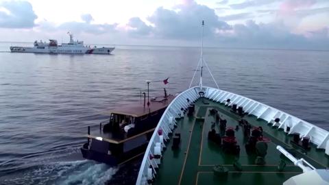 A Chinese Coast Guard vessel collides with a Philippine supply boat near the Second Thomas Shoal, part of the Philippines’ exclusive economic zone. (Screenshot of China Coast Guard video via Reuters)