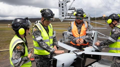 Leading Seaman Emma Searle, Chief Petty Officer Timothy Voight, Leading Seaman Garreth Laurie, and Leading Seaman Doug Thomas conduct pre-flight checks on a ScanEagle remotely piloted aircraft from 822X Squadron at Jervis Bay Airfield, Jervis Bay Territory. (Royal Australian Navy)