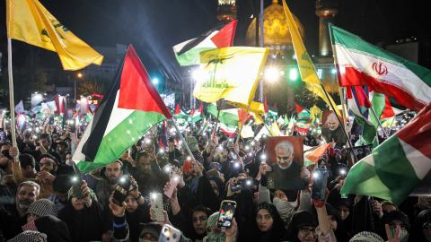 Demonstrators gather with Iranian and Palestinian flags and the yellow flags of the Lebanese Shiite movement Hezbollah during a protest in Tehran in support of Palestinians in the Gaza Strip on October 20, 2023. (AFP via Getty Images)