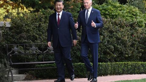 United States President Joe Biden and Chinese President Xi Jinping walk together after a meeting during the Asia-Pacific Economic Cooperation (APEC) Leaders' week in Woodside, California, on November 15, 2023. (Brendan Smialowski/AFP via Getty Images)