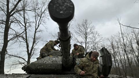 Ukrainian servicemen check their Sweden made CV90 armored infantry combat vehicle on a position pointing in the direction of Bakhmut in the Donetsk region on November 27, 2023. (Genya Savilov/AFP via Getty Images)