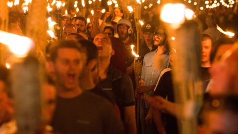 Neo Nazis, Alt-Right, and White Supremacists take part in a match the night before the "Unite the Right" rally in Charlottesville, Virginia. (Zach D Roberts/NurPhoto via Getty Images)