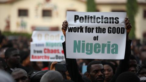 Christians hold signs as they march on the streets of Abuja during a prayer and penance for peace and security in Nigeria on March 1, 2020. (Kola Sulaimon/AFP via Getty Images)