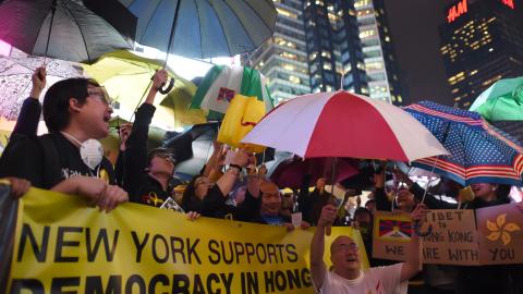 Hundreds gather in Times Square to rally in support of Hong Kong's "Umbrella Revolution" on October 1, 2014, in New York. (Don Emmert/AFP via Getty Images)