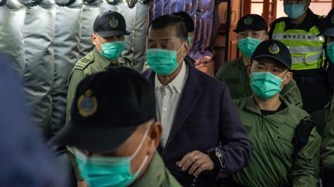 Hong Kong media tycoon Jimmy Lai founder and owner of Apple Daily newspaper is being escorted by Correctional Service Department officers to leave the Court of Final Appeal on December 31, 2020, in Hong Kong, China. (Anthony Kwan via Getty Images)