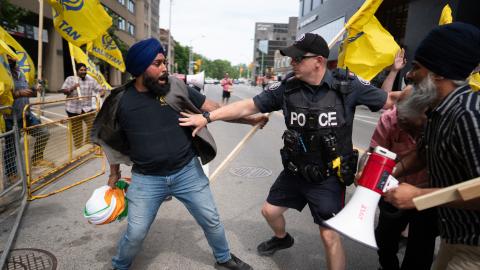 Sikhs protestors for the independence of Khalistan scuffle with police in front of the Indian Consulate in Toronto, Canada, on July 8, 2023. (Photo by Geoff Robins / AFP) (Photo by GEOFF ROBINS/AFP via Getty Images)