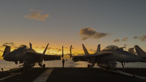 The Arleigh Burke-class guided-missile destroyer USS Daniel Inouye sails behind the Nimitz-class aircraft carrier USS Theodore Roosevelt on January 25, 2024. (Chris Williamson via DVIDS)