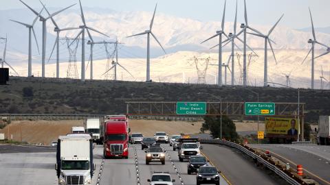 Wind turbines operate at a wind farm a key power source for the Coachella Valley as vehicles drive on February 22, 2023, near Whitewater, California. (Mario Tama via Getty Images)