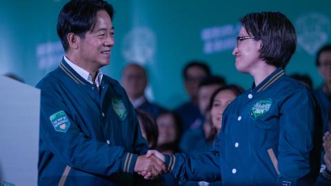 President-elect Lai Ching-te and Vice President–elect Bi-khim Hsiao shake hands during a rally for the presidential and legislative elections in Taipei, Taiwan, on January 13, 2024. (Walid Berrazeg via Getty Images)