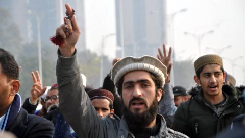 Youth activists of Muslim Talba Mahaz shout slogans during a protest against Iranian air strikes. (Raja Imran Bahadert via Getty Images)