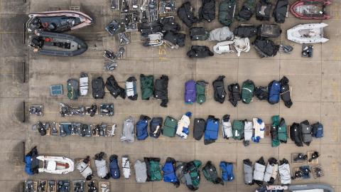 Boats and outboard motors assumed to have been used by migrants to cross the English Channel lie in a Border Force holding facility on January 17, 2024, in Dover, England. (Dan Kitwood via Getty Images)