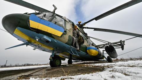 A serviceman of the 11th separate army aviation brigade "Kherson" of the Armed Forces of Ukraine is seen by a helicopter. (Photo credit should read Dmytro Smolienko / Ukrinform/Future Publishing via Getty Images)