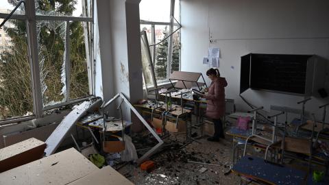 A school director inspects a classroom damaged as a result of a Russian missile attack in Lviv, Ukraine, on February 15, 2024. (Yuriy Dyachyn/AFP via Getty Images)