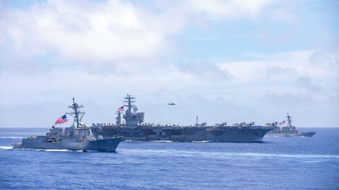 The Arleigh Burke-class guided missile destroyer USS Chung-Hoon (DDG 93), aircraft carrier USS Nimitz (CVN 68) and Arleigh Burke-class guided missile destroyer USS Wayne E. Meyer (DDG 108) sail in formation in the Philippine Sea, June 9, 2023. (U.S. Navy photo by Mass Communication Specialist 1st Class Ryre Arciaga)