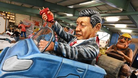A model of Xi Jinping driving an electric car on February 6, 2024, in Mainz, Germany. (Photo by Arne Dedert/picture alliance via Getty Images)