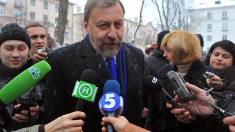 Belarusian presidential candidates Andrei Sannikov speaks to journalists after voting in Minsk, Belarus, on December 19, 2010. (Photo by Maksim Malinouski/AFP via Getty Images)