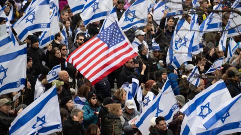 Demonstrators hold US and Israeli flags during a rally in Central Park marking 150 days since hostages were taken in attack on Israel on March 10, 2024 in New York City. (Photo by Noam Galai/Getty Images)