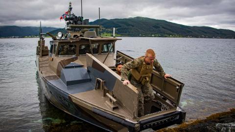 U.S. Marines assigned to the 26th Marine Expeditionary Unit (Special Operations Capable) (MEU(SOC)) disembark a Norwegian CB-90 class fast assault craft during a bilateral exercise in Narvik, Norway, Aug. 16, 2023.