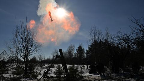 Ukrainian servicemen fire a 120mm mortar during military exercises by assault units in Zhytomyr, Ukraine, on January 30, 2024. (Photo by Sergei Supinsky/AFP via Getty Images)