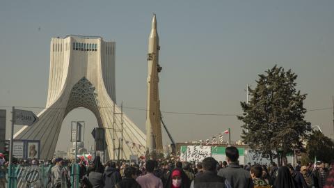 Iranians attend the annual rally commemorating the 1979 Islamic Revolution as domestically built missiles and a satellite carrier are displayed at the Azadi Square in in Tehran, Iran, on Sunday, February 11, 2024. (Photo by Majid Saeedi/Getty Images)